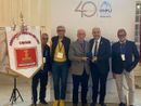 Il riconoscimento a Giulio Brarda, al centro della foto
