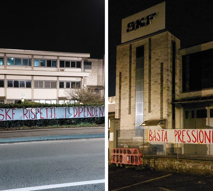 ingresso di fabbrica con striscioni appesi