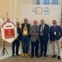 Il riconoscimento a Giulio Brarda, al centro della foto