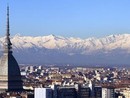 panorama di Torino con montagne innevate e Mole